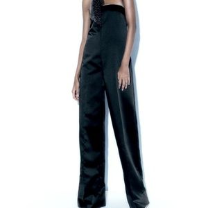 Strapless long jumpsuit with straight neckline, rhinestone apliquè.